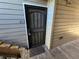 View of the front door to unit 213 featuring a black metal security screen at 3100 S Federal Blvd # 213, Denver, CO 80236