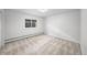 Well-lit bedroom with neutral carpet, a window providing natural light, and ample space at 970 S Steele St, Denver, CO 80209