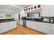 Bright kitchen featuring stainless steel appliances, granite countertops, and hardwood floors at 970 S Steele St, Denver, CO 80209