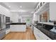 Bright kitchen with modern appliances, sleek cabinetry, and hardwood floors at 970 S Steele St, Denver, CO 80209