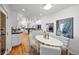 Open kitchen concept flowing into a dining area, featuring modern appliances and finishes at 970 S Steele St, Denver, CO 80209