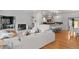 Bright living room featuring a fireplace, sleek furniture, and an open floor plan at 970 S Steele St, Denver, CO 80209