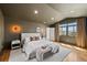 Main bedroom with hardwood floors, ambient lighting, and a large window at 970 S Steele St, Denver, CO 80209
