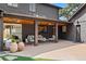 Covered patio with stylish decor and furniture, offering an inviting outdoor living space in the backyard at 970 S Steele St, Denver, CO 80209