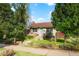 Brick ranch home with landscaped yard and inviting front porch at 3200 N Fillmore St, Denver, CO 80205