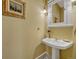 Traditional powder room featuring a pedestal sink and gold accents at 861 N Humboldt St # A, Denver, CO 80218