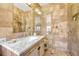 A bathroom showcasing a marble vanity and glass-enclosed shower with decorative earth tone tiles at 861 N Humboldt St # A, Denver, CO 80218