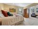 Bedroom with a large wood wardrobe, chair and shuttered window at 861 N Humboldt St # A, Denver, CO 80218