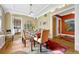 Dining room with a glass top table, six chairs, and beautiful decor at 861 N Humboldt St # A, Denver, CO 80218