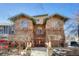 Charming exterior view showcasing the unique brick architecture and the colorful trees surrounding the property at 861 N Humboldt St # A, Denver, CO 80218