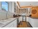 Bright kitchen features white cabinets, stainless steel appliances, and wood floors at 861 N Humboldt St # A, Denver, CO 80218