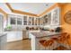 Eat-in kitchen with stainless steel appliances, bar seating, and white cabinets at 861 N Humboldt St # A, Denver, CO 80218