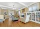 Sunlit living room featuring hardwood floors, neutral tones, and stylish built-in shelving at 861 N Humboldt St # A, Denver, CO 80218