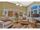 Bright and airy living room featuring large windows and hardwood floors, creating an inviting space at 861 N Humboldt St # A, Denver, CO 80218