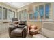 Sitting area with comfortable chairs, large windows and desk area at 861 N Humboldt St # A, Denver, CO 80218