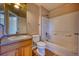 Bright bathroom features a single sink vanity, tile flooring, and a shower over tub at 7243 S Millbrook Ct # F, Aurora, CO 80016