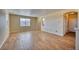 Open floor plan with hardwood floors, natural light, and neutral walls at 7243 S Millbrook Ct # F, Aurora, CO 80016