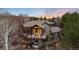 Aerial view of home with a deck, mountain views, outdoor fireplace, and hammock at 2 Twin Flower, Littleton, CO 80127