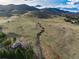 Sprawling hillside property with stunning mountain views, trails, and a beautiful home at 2 Twin Flower, Littleton, CO 80127