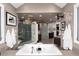 Spacious bathroom featuring a soaking tub, separate shower, and contemporary fixtures at 2 Twin Flower, Littleton, CO 80127