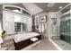 Stylish bathroom with a soaking tub, separate shower, and mountain view at 2 Twin Flower, Littleton, CO 80127