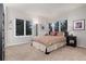 Bright bedroom with large windows showcasing scenic views, carpet flooring, and stylish lamps at 2 Twin Flower, Littleton, CO 80127