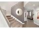 Entryway with a staircase and views into the living room at 2 Twin Flower, Littleton, CO 80127