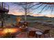 Inviting outdoor area features a fire pit, grill, and seating with views of open space at 2 Twin Flower, Littleton, CO 80127