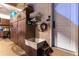 Spacious garage with storage cabinets, wash basin and white door leading outside at 2 Twin Flower, Littleton, CO 80127