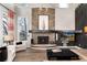 Inviting living room with stone fireplace, hardwood floors, and comfortable seating at 2 Twin Flower, Littleton, CO 80127