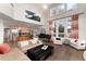 Open floor plan featuring living room, piano, island kitchen with bar seating and stainless steel appliances at 2 Twin Flower, Littleton, CO 80127