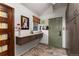 Practical mud room with counter space, storage cabinets, and convenient access to the outdoors at 2 Twin Flower, Littleton, CO 80127