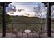 Stunning sunset mountain view from covered patio seating for relaxation and enjoying the outdoors at 2 Twin Flower, Littleton, CO 80127