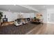 Spacious basement featuring a living area, dining space, and walkout access at 16202 W 95Th Ln, Arvada, CO 80007