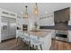 Gourmet kitchen with stainless steel appliances, granite countertops, and a large center island with seating at 16202 W 95Th Ln, Arvada, CO 80007