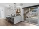 Modern kitchen boasts island with bar stool seating and stainless steel appliances at 16202 W 95Th Ln, Arvada, CO 80007