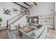 Spacious living room with high ceilings, hardwood floors, and large windows, with open staircase at 16202 W 95Th Ln, Arvada, CO 80007