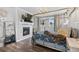Serene main bedroom with a fireplace, hardwood floors, and a luxurious king size canopy bed at 16202 W 95Th Ln, Arvada, CO 80007
