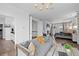 Open Main bedroom layout with sitting area, fireplace, hardwood floors, and natural light at 16202 W 95Th Ln, Arvada, CO 80007
