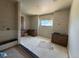 Bathroom featuring double vanities, neutral tile, modern fixtures, and a large window for natural light at 1555 Arrowpoint Ct, Franktown, CO 80116