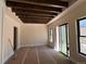 Bedroom with high ceilings, neutral paint, lots of natural light, and access to outdoor patio at 1555 Arrowpoint Ct, Franktown, CO 80116
