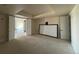 Spacious bedroom with large screen and neutral color and light walls throughout the open floor plan at 1555 Arrowpoint Ct, Franktown, CO 80116