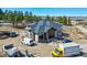 Aerial shot of a modern home under construction, highlighting the attached garage and contemporary design elements at 1555 Arrowpoint Ct, Franktown, CO 80116