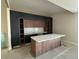 Modern kitchen featuring a large island, custom cabinets, and plenty of countertop space at 1555 Arrowpoint Ct, Franktown, CO 80116