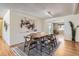 Open concept dining room with hardwood floors and stylish decor at 3004 S Ingalls Way, Denver, CO 80227