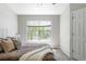 Cozy bedroom featuring a soft bed, natural light, and neutral decor at 7440 E 8Th Ave # 25, Denver, CO 80230