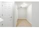 Hallway with tile flooring, neutral walls, and multiple white doors at 7440 E 8Th Ave # 25, Denver, CO 80230