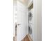 Efficient laundry closet featuring a stacked washer and dryer unit at 7440 E 8Th Ave # 25, Denver, CO 80230