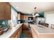 Well-equipped kitchen with stainless steel appliances, island, and ample counter space at 9741 Chambers Dr, Commerce City, CO 80022