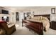 Comfortable main bedroom with a fireplace, cozy seating, and a spacious layout at 9741 Chambers Dr, Commerce City, CO 80022